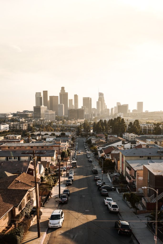 Picture of residential street with city skyline. City of Los Angeles.