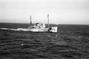 Black and white image of coast guard boat in the ocean