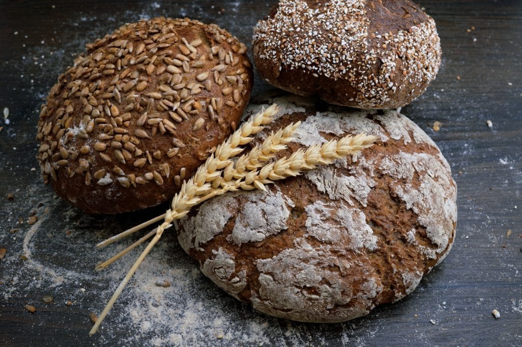Close up of round bread loaves and wheat. Defense logistics agency.