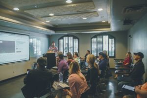 Group of people attending a powerpoint presentation
