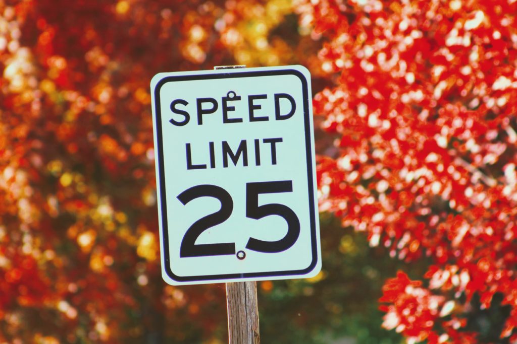 25 mph speed limit sign on colorful fall background. City of Columbus.