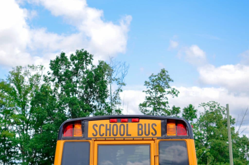Top of yellow school bus under a pretty bright blue sky. Montgomery county public schools.
